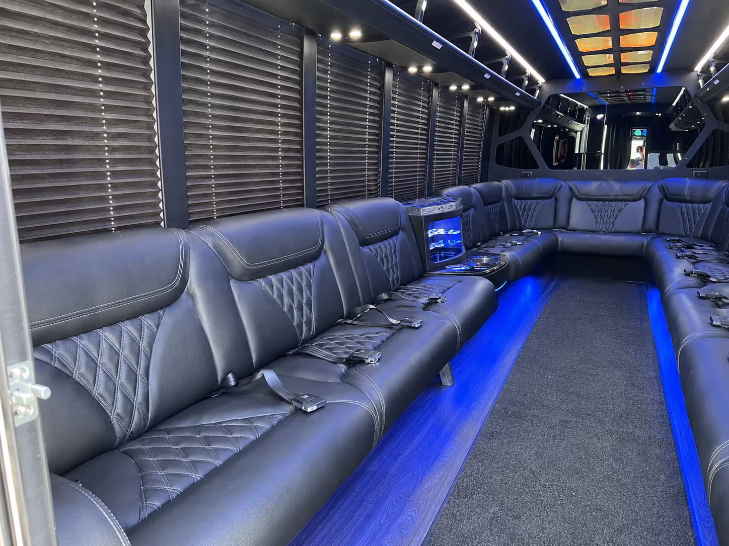 Friends laughing during a party bus celebration in Sacramento